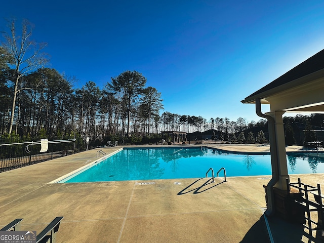 view of swimming pool featuring a patio