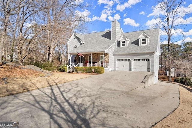 view of front facade with a garage and covered porch