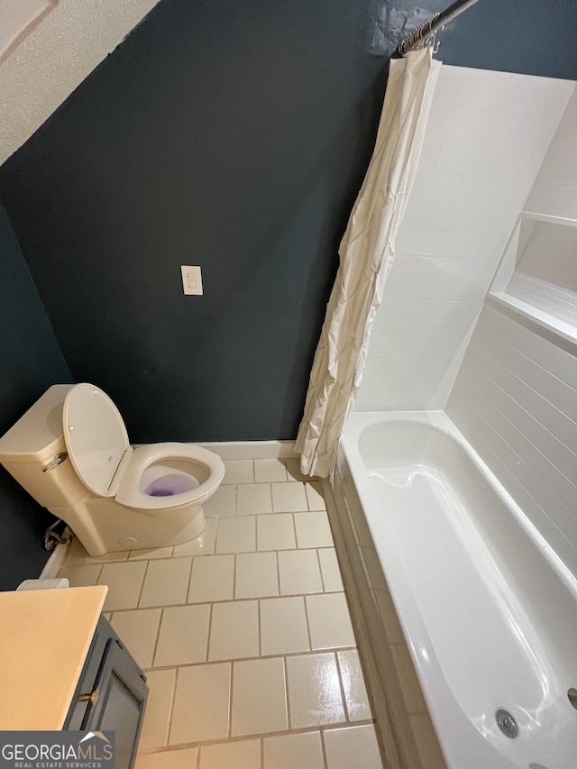 full bathroom with tile patterned flooring, vanity, toilet, and shower / tub combo