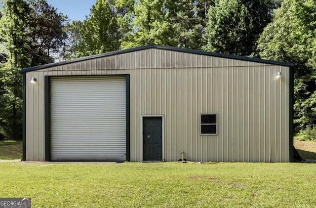 garage featuring a yard