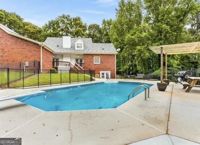 view of pool with a pergola, a patio area, and a diving board