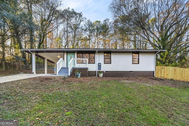 view of front of house featuring a front yard and a carport