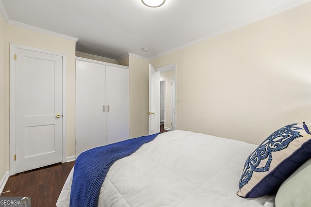 bedroom with crown molding and dark hardwood / wood-style floors