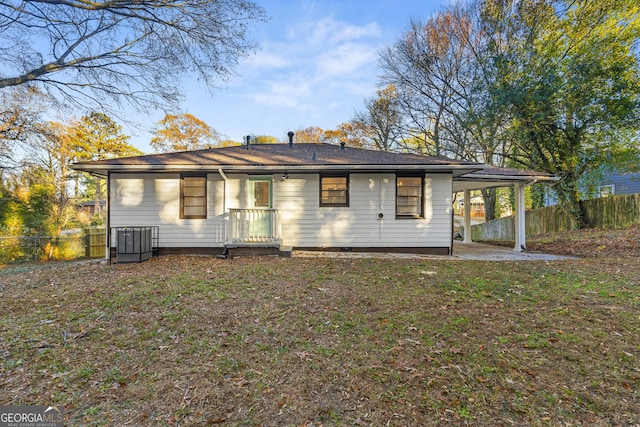 exterior space with a yard and a carport