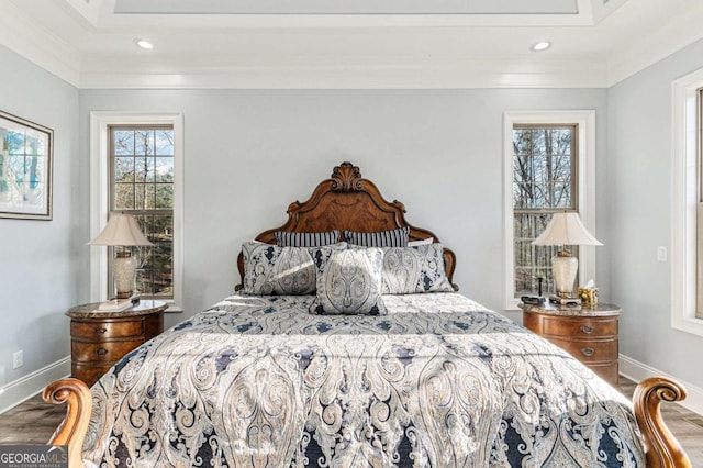 bedroom featuring wood-type flooring and ornamental molding