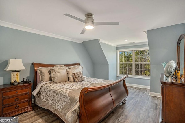 bedroom featuring ceiling fan, crown molding, and dark wood-type flooring