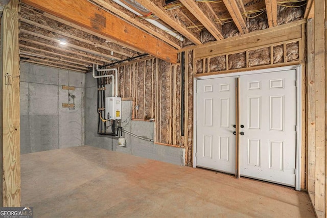 basement featuring water heater