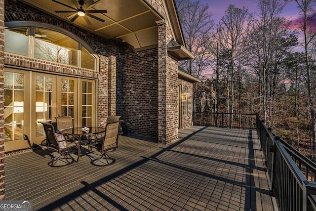 deck at dusk with ceiling fan