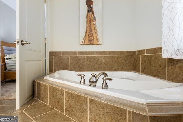 bathroom featuring tile patterned flooring and a relaxing tiled tub