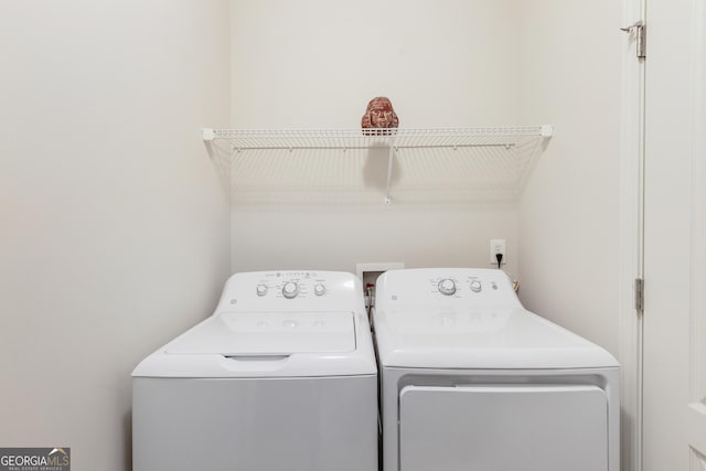 laundry room featuring separate washer and dryer