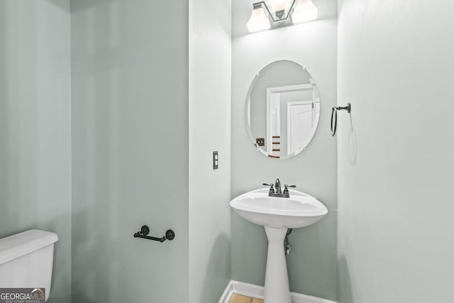 bathroom featuring toilet