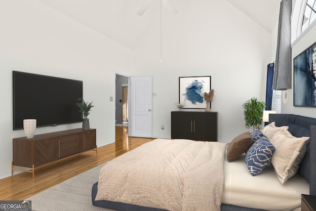 bedroom featuring ceiling fan, high vaulted ceiling, and hardwood / wood-style floors