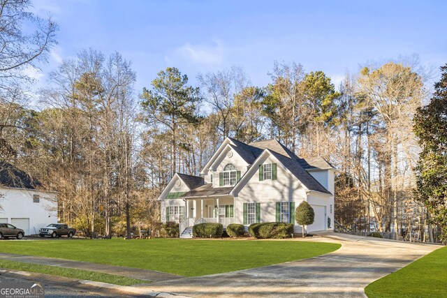 view of front of home with a garage, a porch, and a front lawn