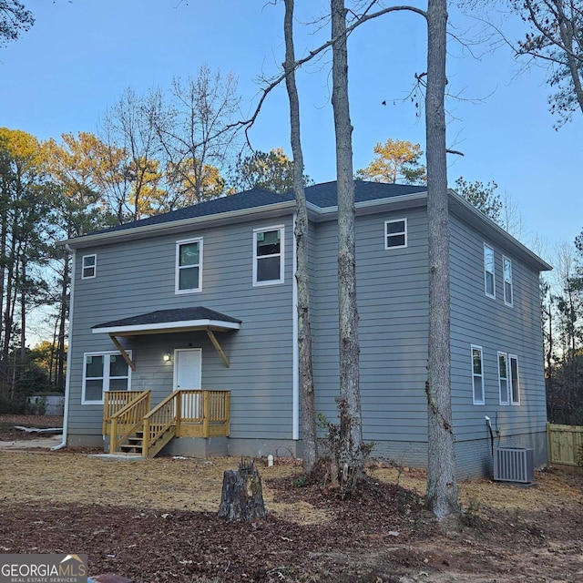 rear view of property with central air condition unit