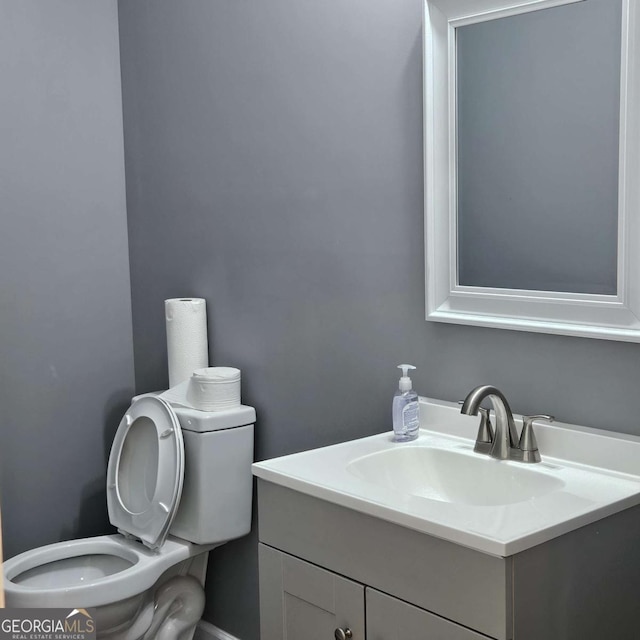 bathroom with vanity and toilet