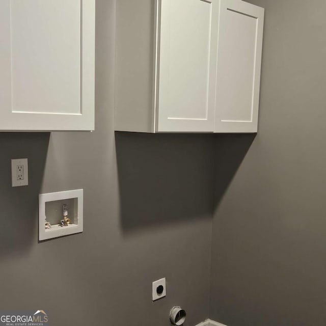 washroom featuring cabinets, washer hookup, and electric dryer hookup