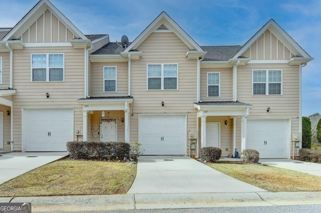 townhome / multi-family property featuring a garage