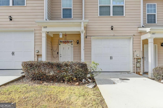 view of exterior entry with a garage