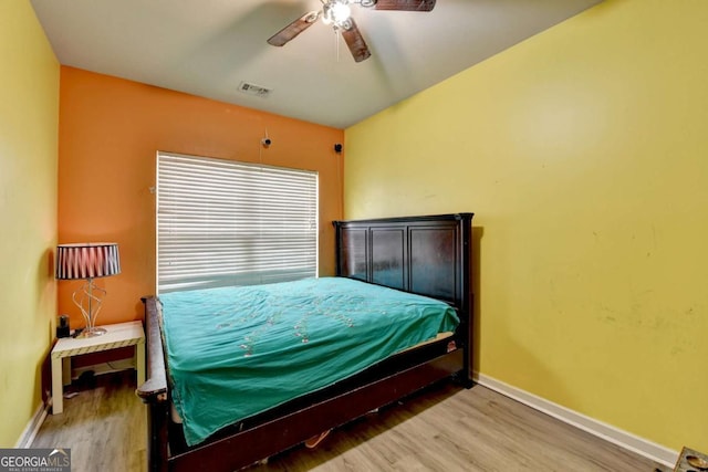 bedroom featuring ceiling fan and hardwood / wood-style flooring