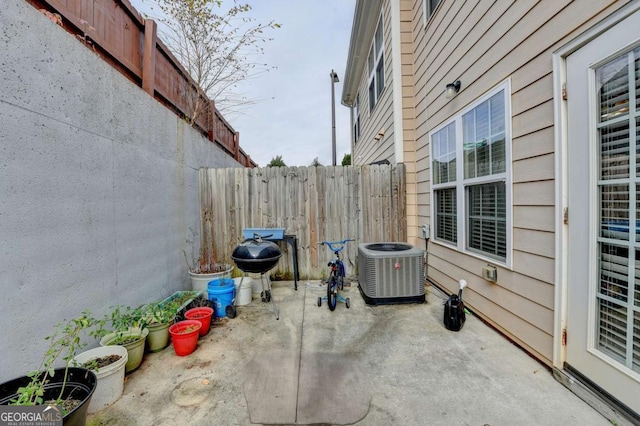 view of patio / terrace featuring cooling unit and grilling area