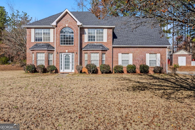 view of front facade with a front lawn