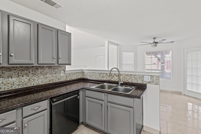 kitchen featuring dishwasher, light tile patterned floors, gray cabinetry, and sink