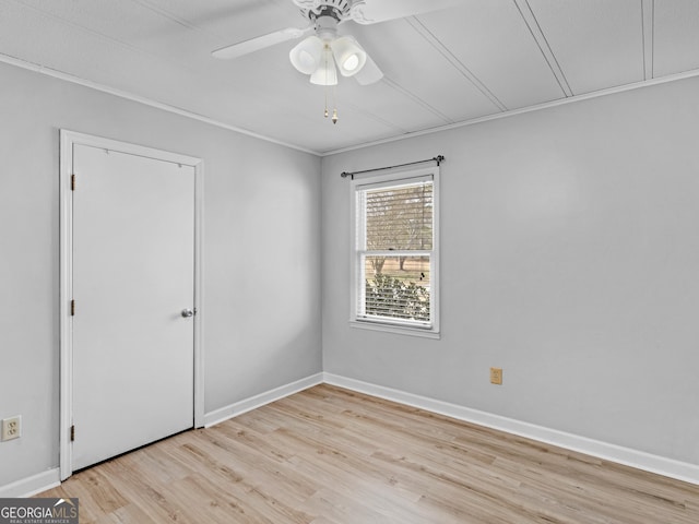 unfurnished room featuring ceiling fan and light wood-type flooring