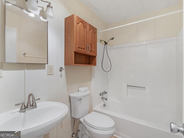 full bathroom with shower / washtub combination, sink, and toilet