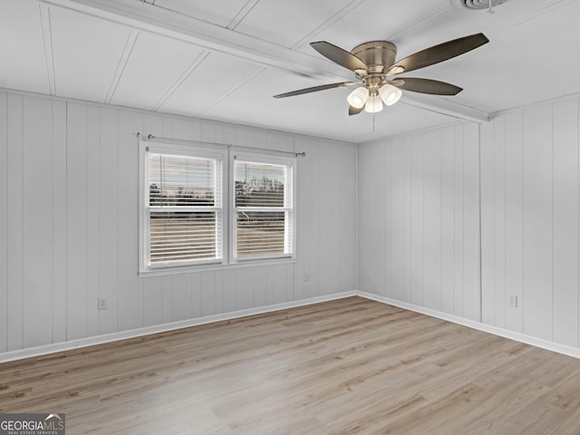 spare room featuring ceiling fan and light hardwood / wood-style flooring