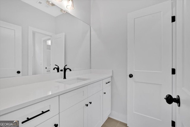 bathroom featuring vanity and tile patterned flooring