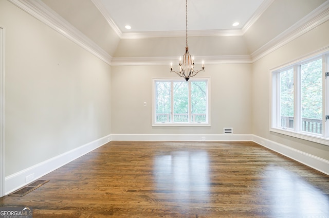 unfurnished dining area with dark hardwood / wood-style floors, an inviting chandelier, lofted ceiling, and crown molding