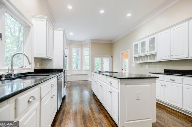 kitchen featuring white cabinetry and sink