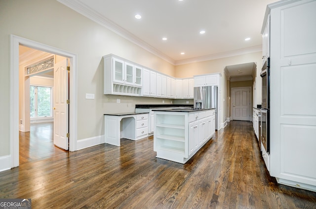 kitchen with double wall oven, crown molding, dark hardwood / wood-style floors, white cabinetry, and stainless steel fridge with ice dispenser