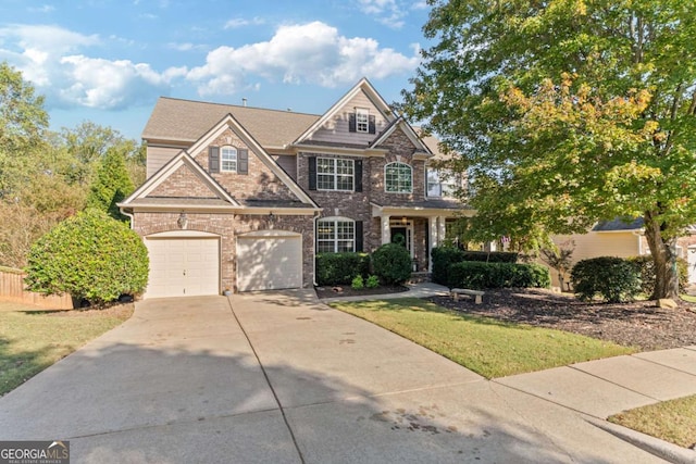 craftsman-style house with a front yard and a garage