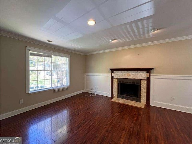 unfurnished living room featuring dark hardwood / wood-style floors and crown molding