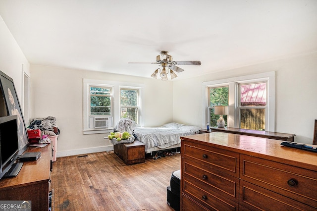 bedroom with ceiling fan and light wood-type flooring