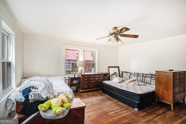 bedroom featuring dark hardwood / wood-style flooring and ceiling fan