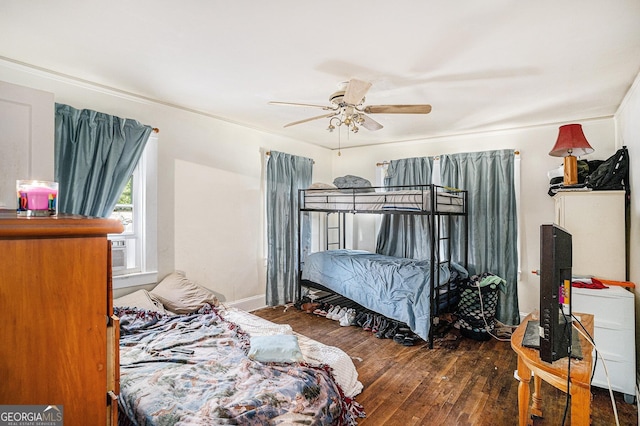 bedroom featuring ceiling fan and dark hardwood / wood-style flooring