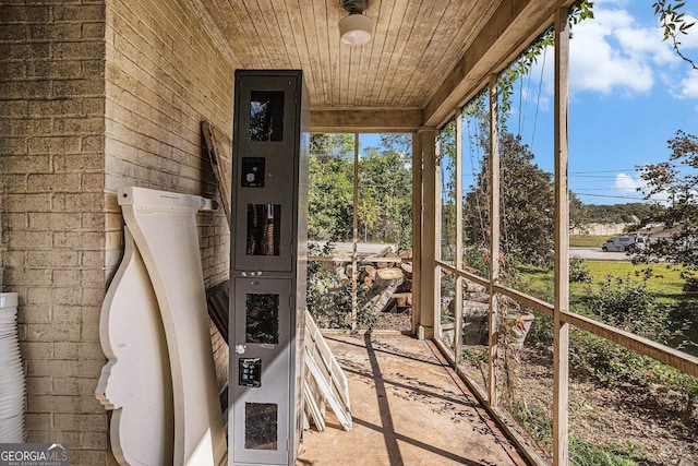 unfurnished sunroom with wooden ceiling