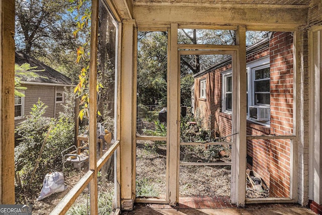 unfurnished sunroom with cooling unit