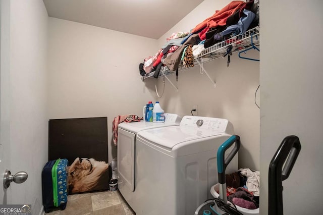 washroom with washer and dryer