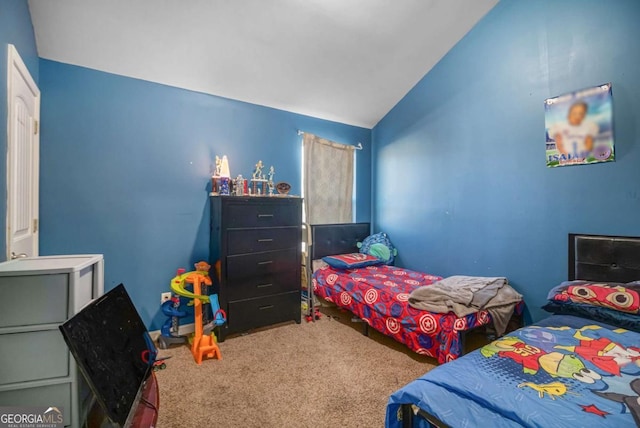 bedroom with carpet and vaulted ceiling