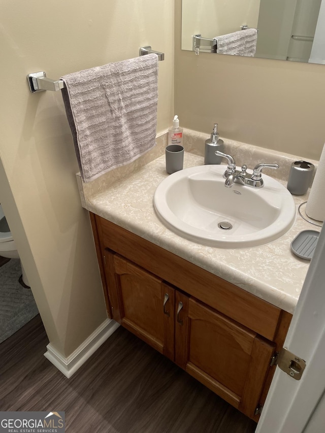 bathroom with wood-type flooring and vanity