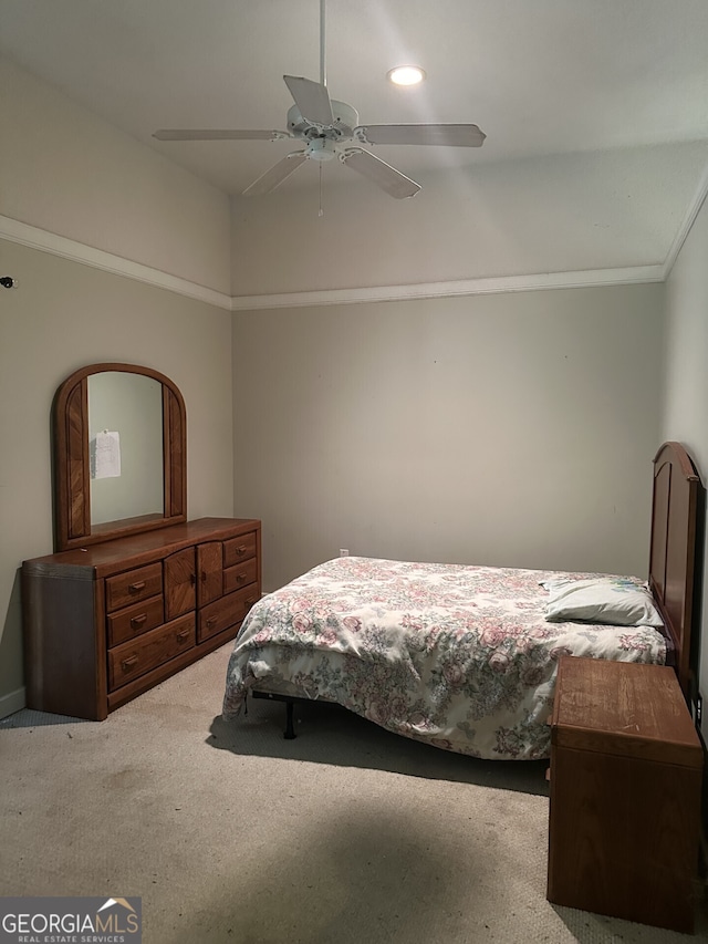 bedroom with ceiling fan and light carpet