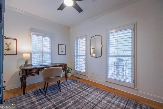 office space with hardwood / wood-style flooring, ceiling fan, and ornamental molding