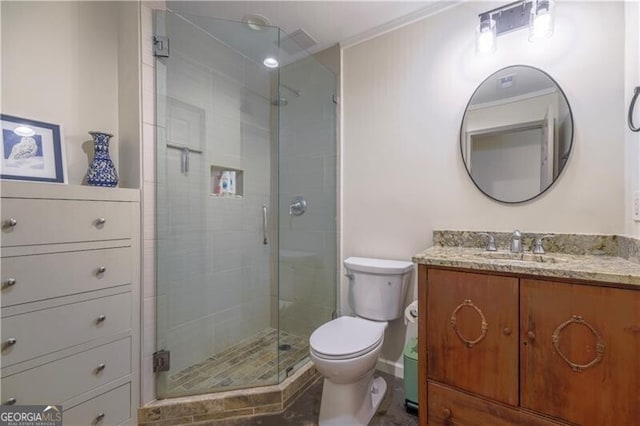 bathroom featuring walk in shower, vanity, and toilet