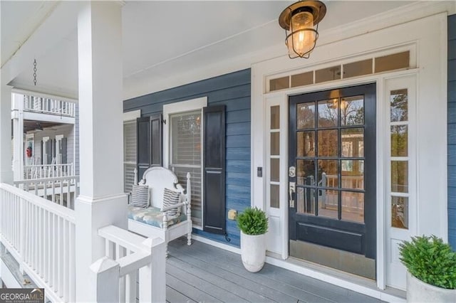 entrance to property featuring a porch