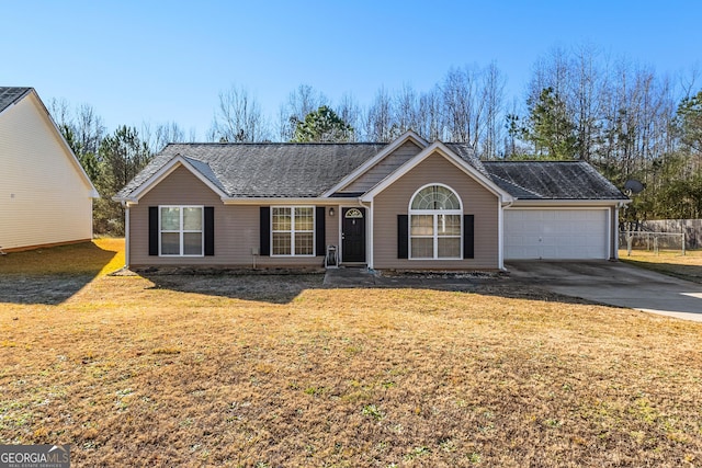 ranch-style home with a front lawn and a garage