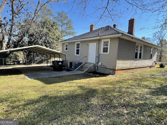 exterior space with a yard and a carport