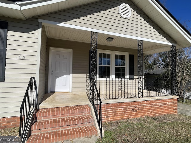 doorway to property with a porch